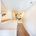 Basement Finishing - White Countertops + Wine Storage