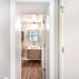 Basement Renovation - White Bathroom, Beige Walls