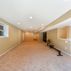 Basement Finishing - Yellow Walls, Beige Carpet