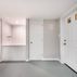 Renovated basement with a pet shower and tiled flooring