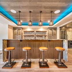 Beautiful basement remodel with a large wet bar, wine cellar and movie theater