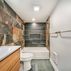 Finished Basement with a kitchen and exposed brick walls., Washington, DC